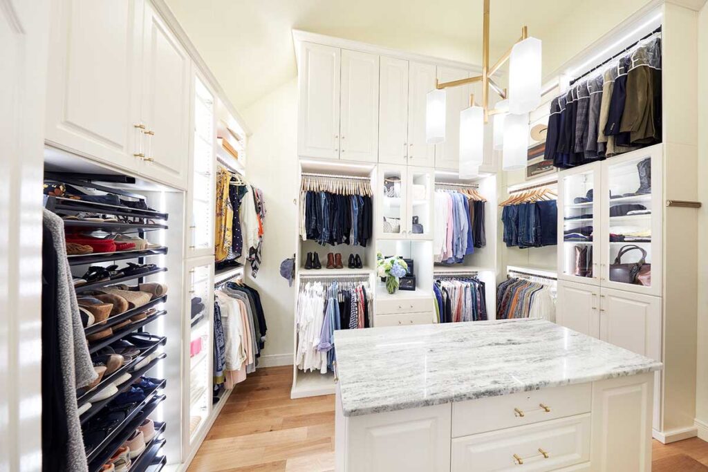 Custom closet design showing custom shelving and cabinetry