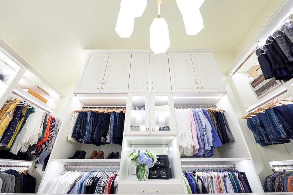 Custom closet built-in showing space above racks with cabinets