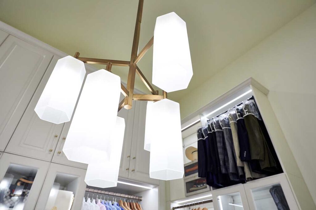 Custom closet showing light fixture