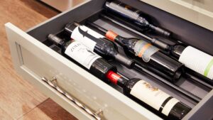 Kitchen design with custom cabinetry with wine drawer