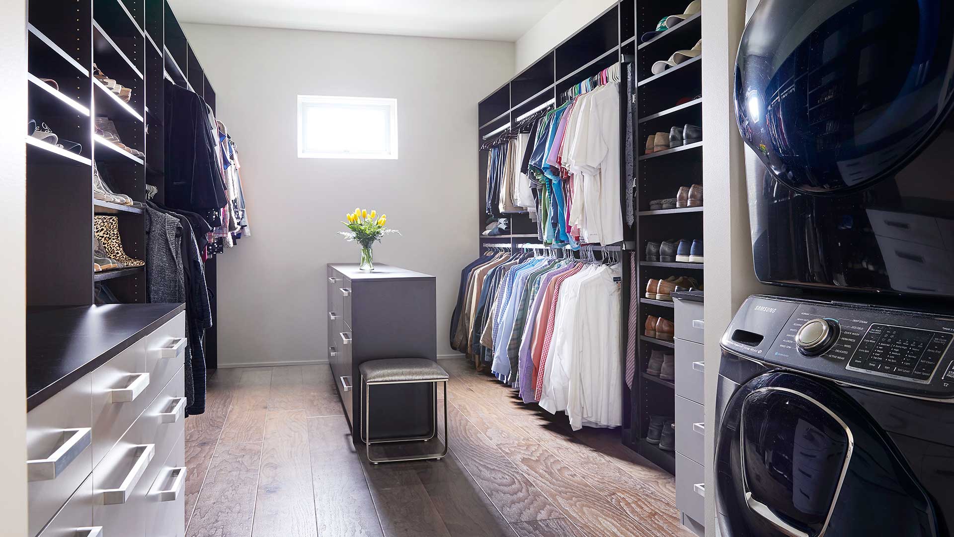 Custom closet design showing hangin clothes and shelving