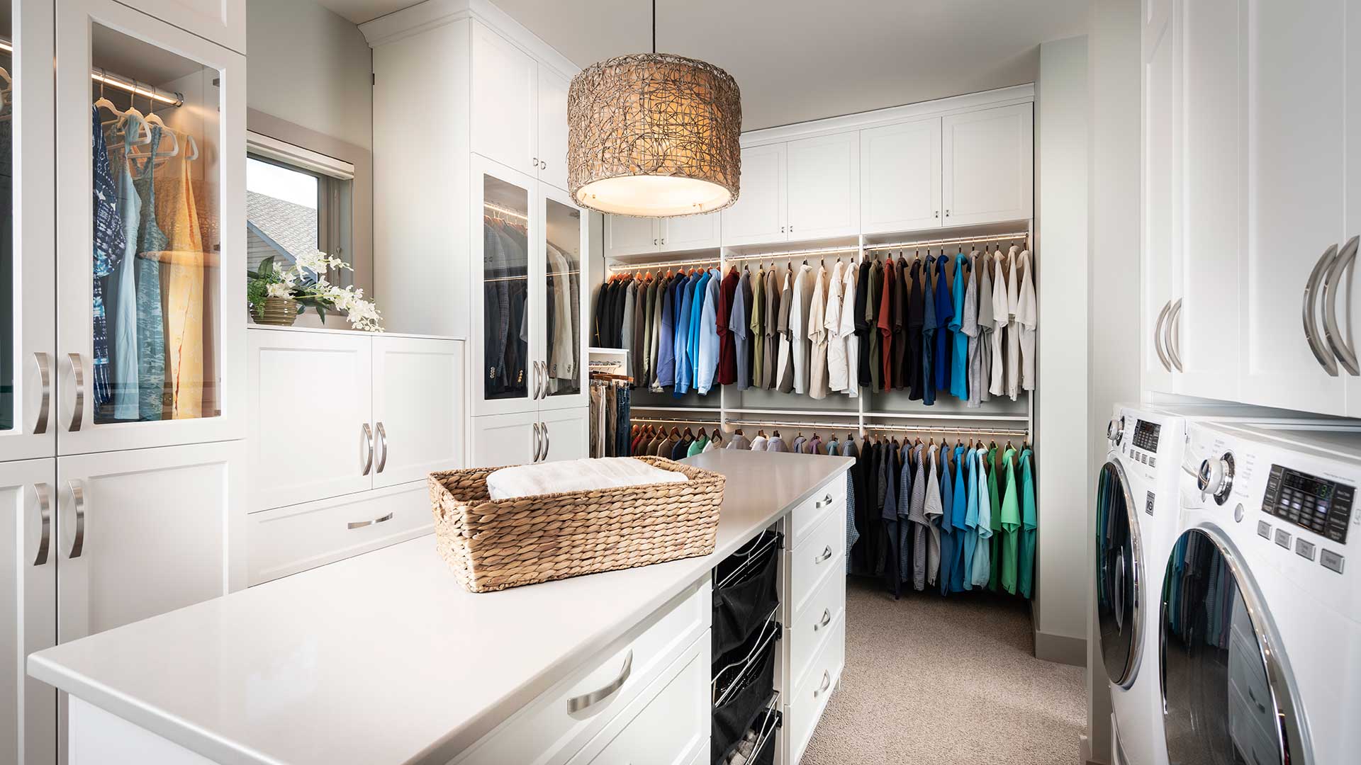 Custom closet featuring beautiful dresser feature and hanging racks