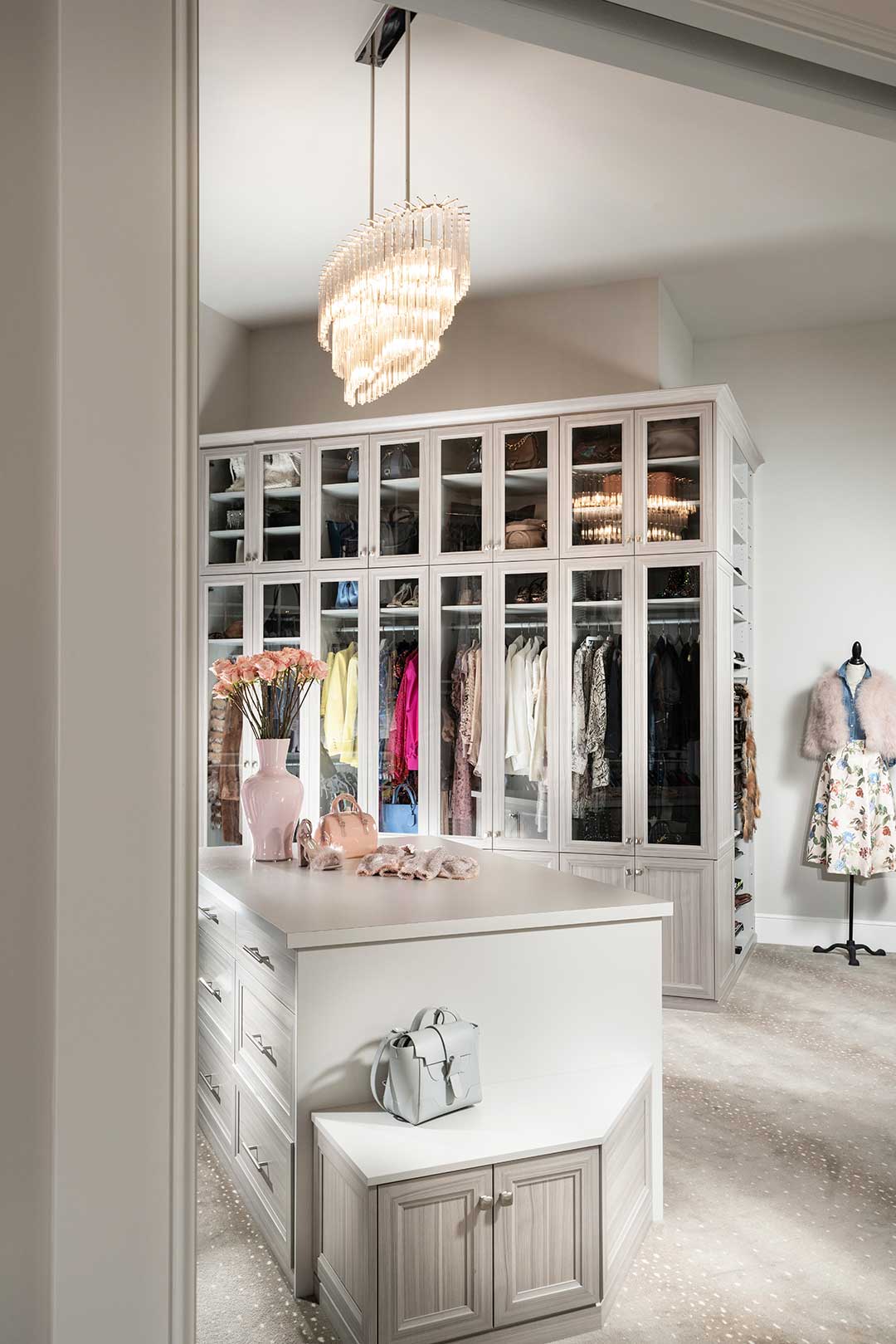 Custom closet with glass door built-in and custom dresser