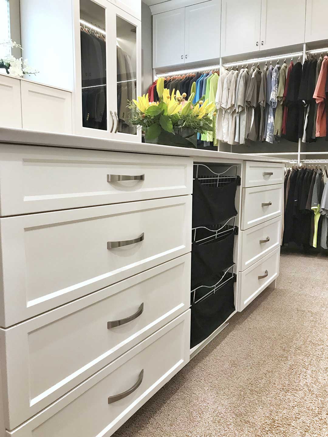 Closet built-in showing dresser and clothes hamper