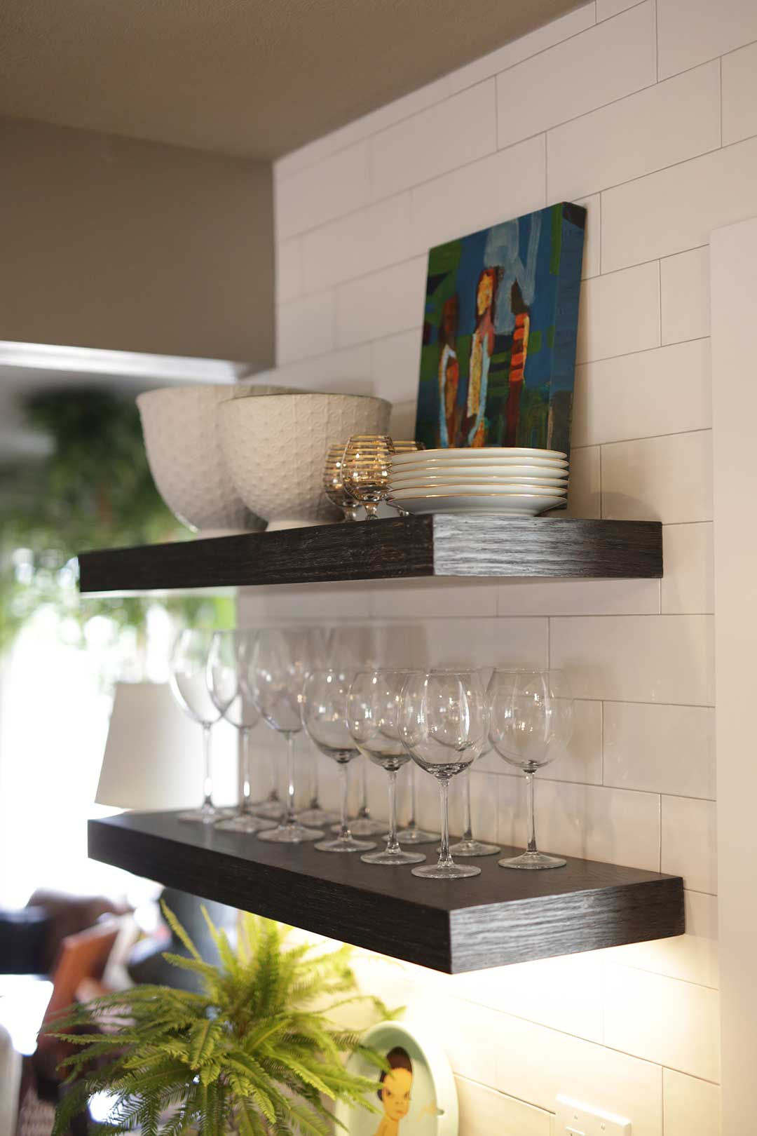 Kitchen design with custom cabinetry and wine shelves