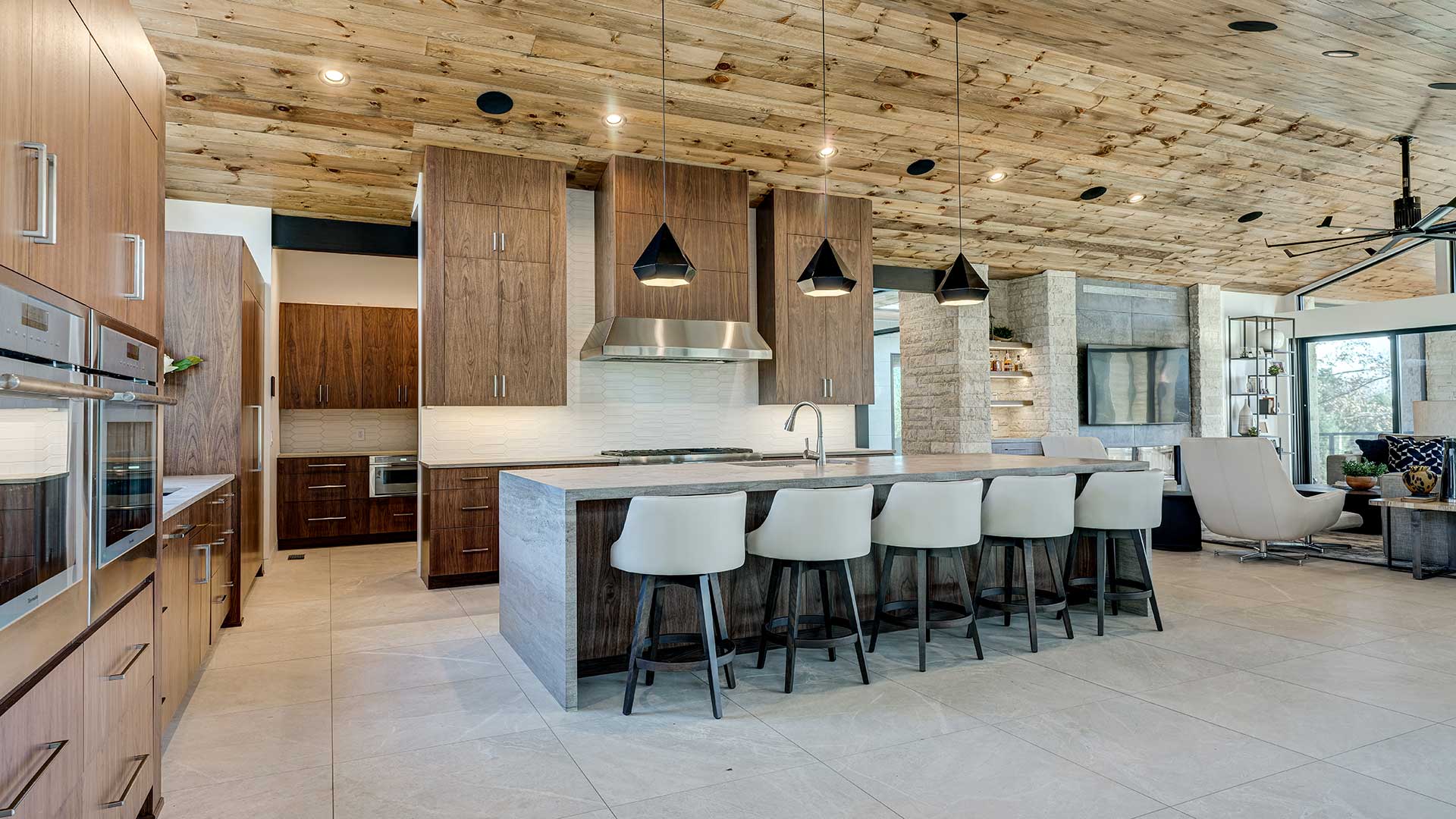 Modern Kitchen design with custom cabinetry and island seating