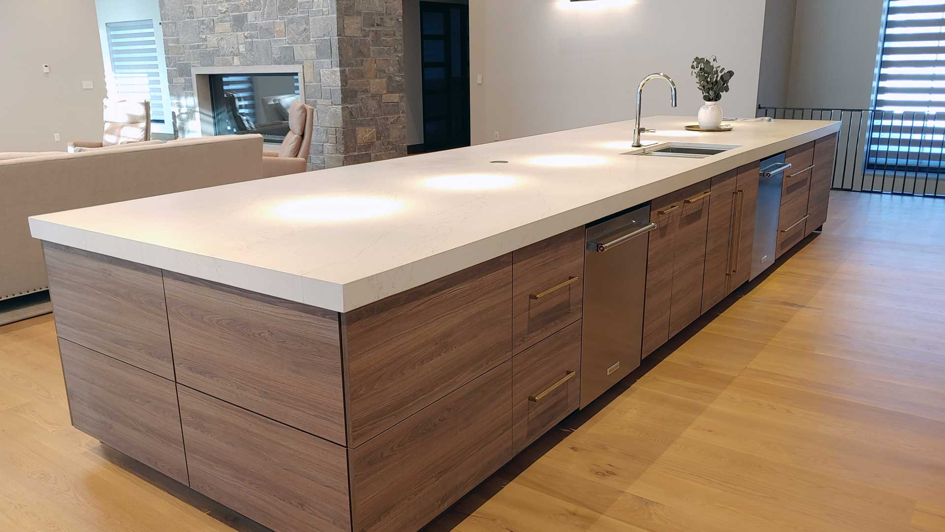 Modern kitchen with clean lines featuring cabinetry and tabletop