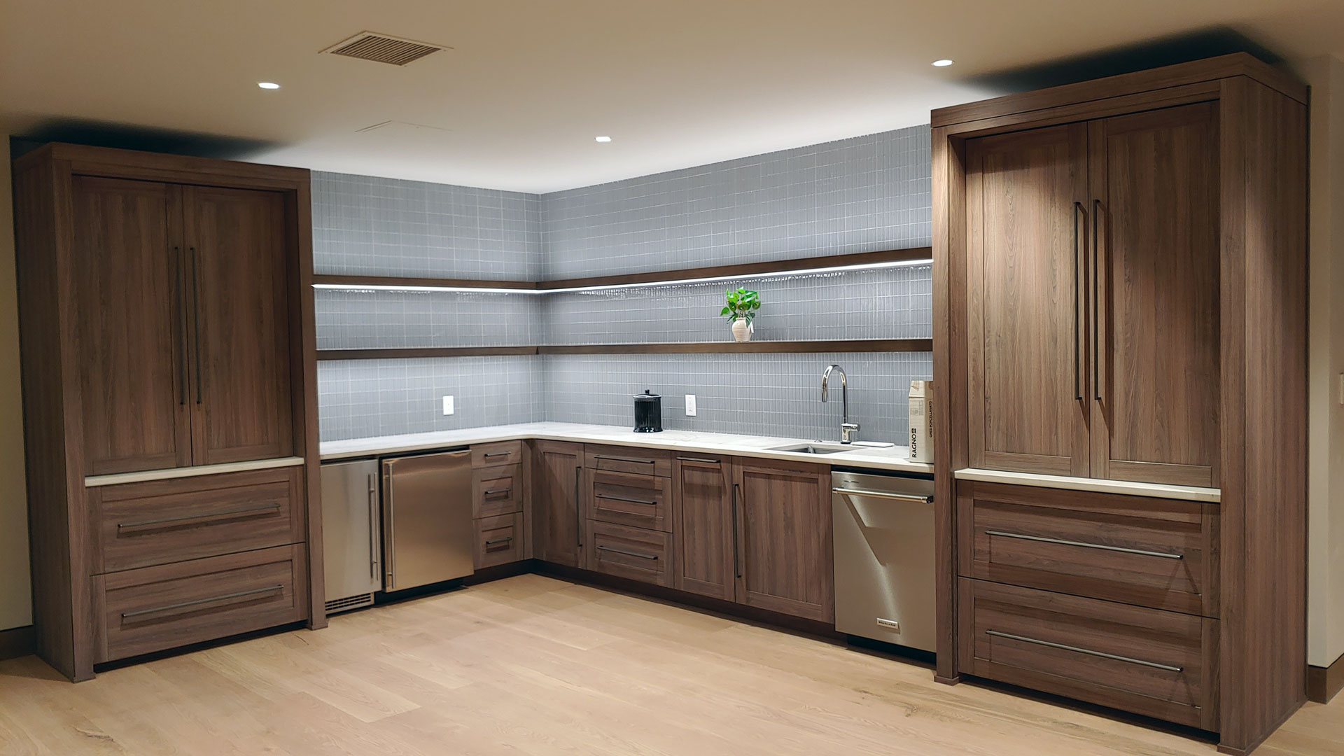 Modern kitchen with clean lines featuring cabinetry