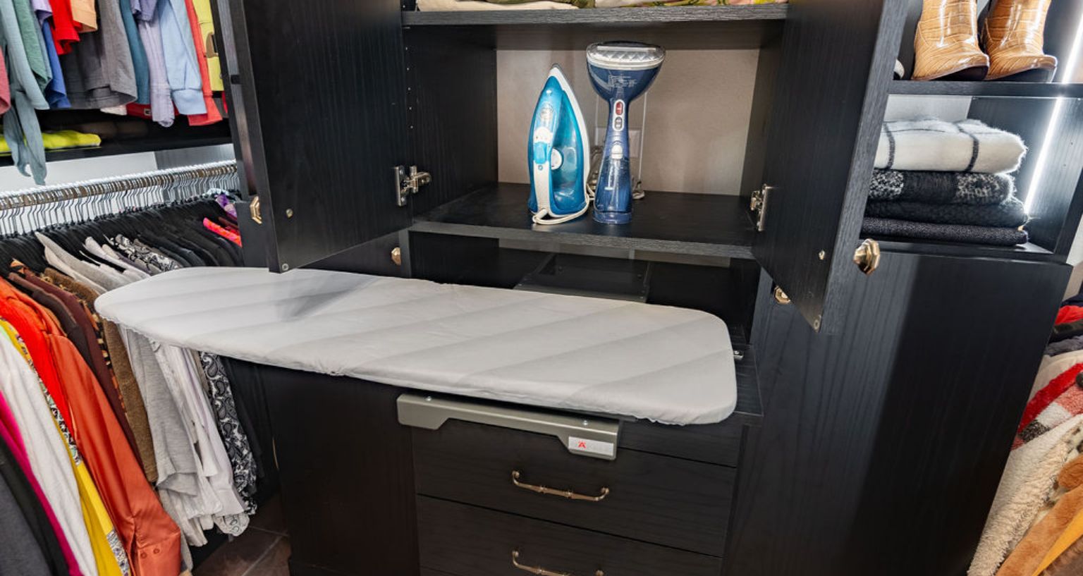 classy closet with ironing board pull-out