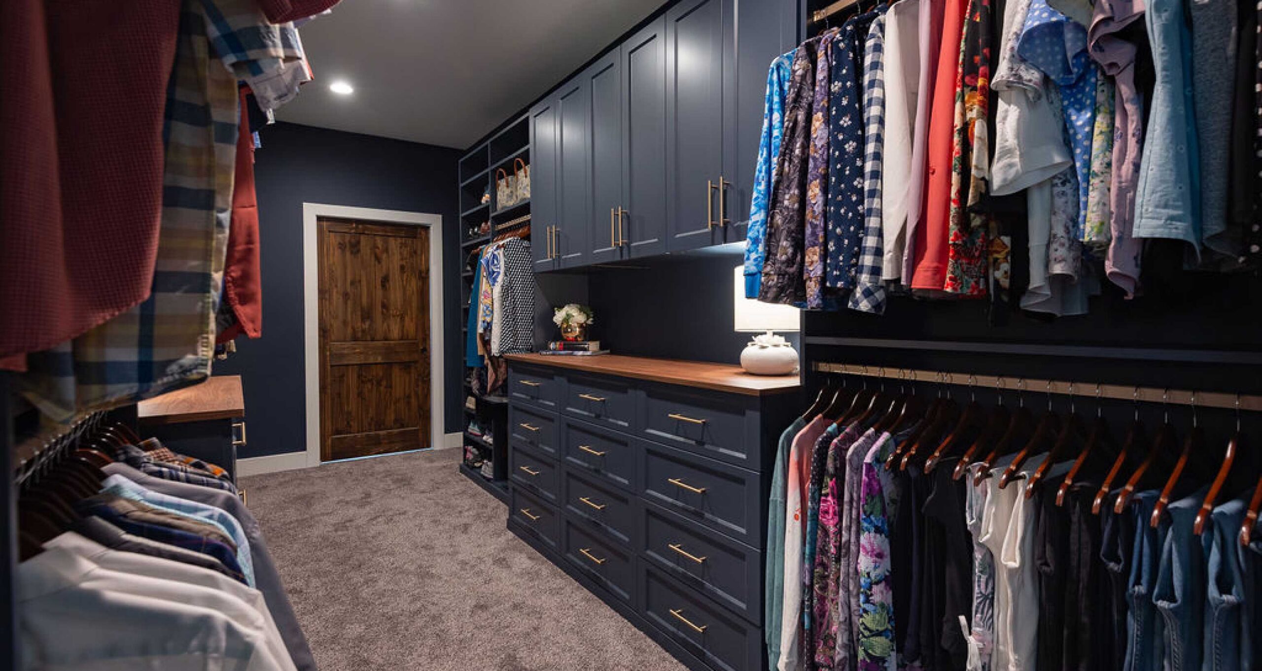 Slate blue closet cabinetry and dressers