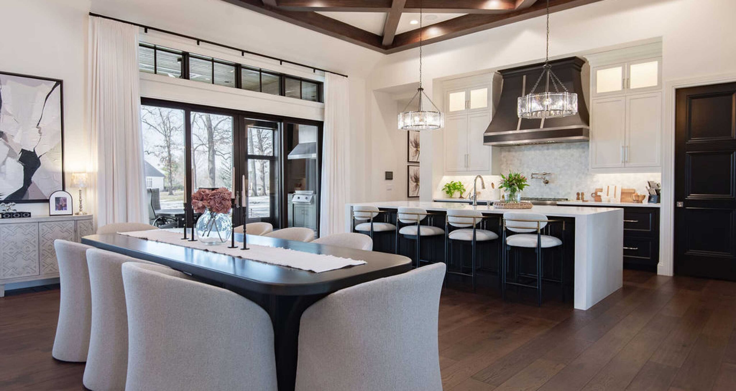 Elegant and open kitchen with white cabinetry and spacious floorpan
