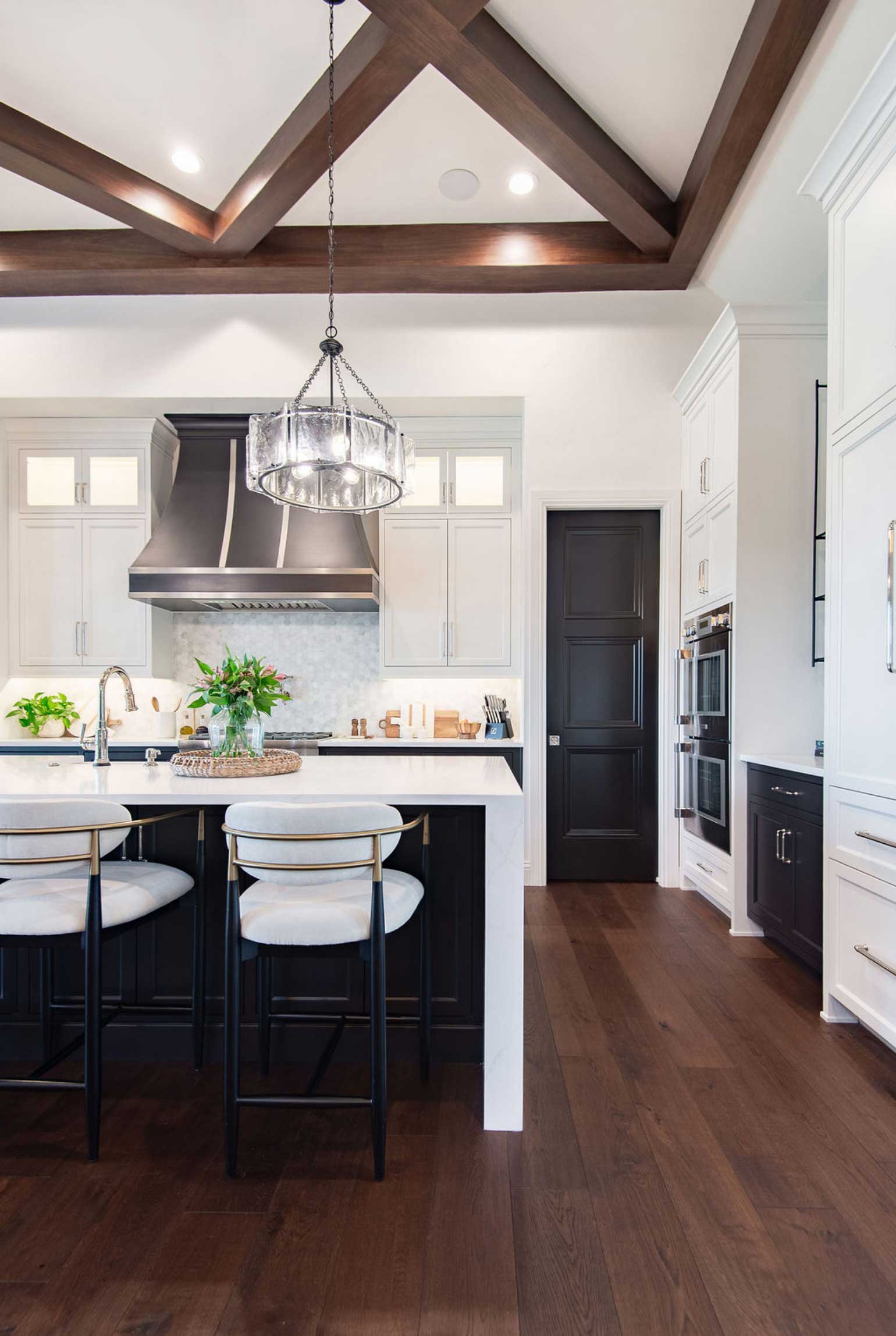 Elegant and open kitchen with white cabinetry with crisp design lines