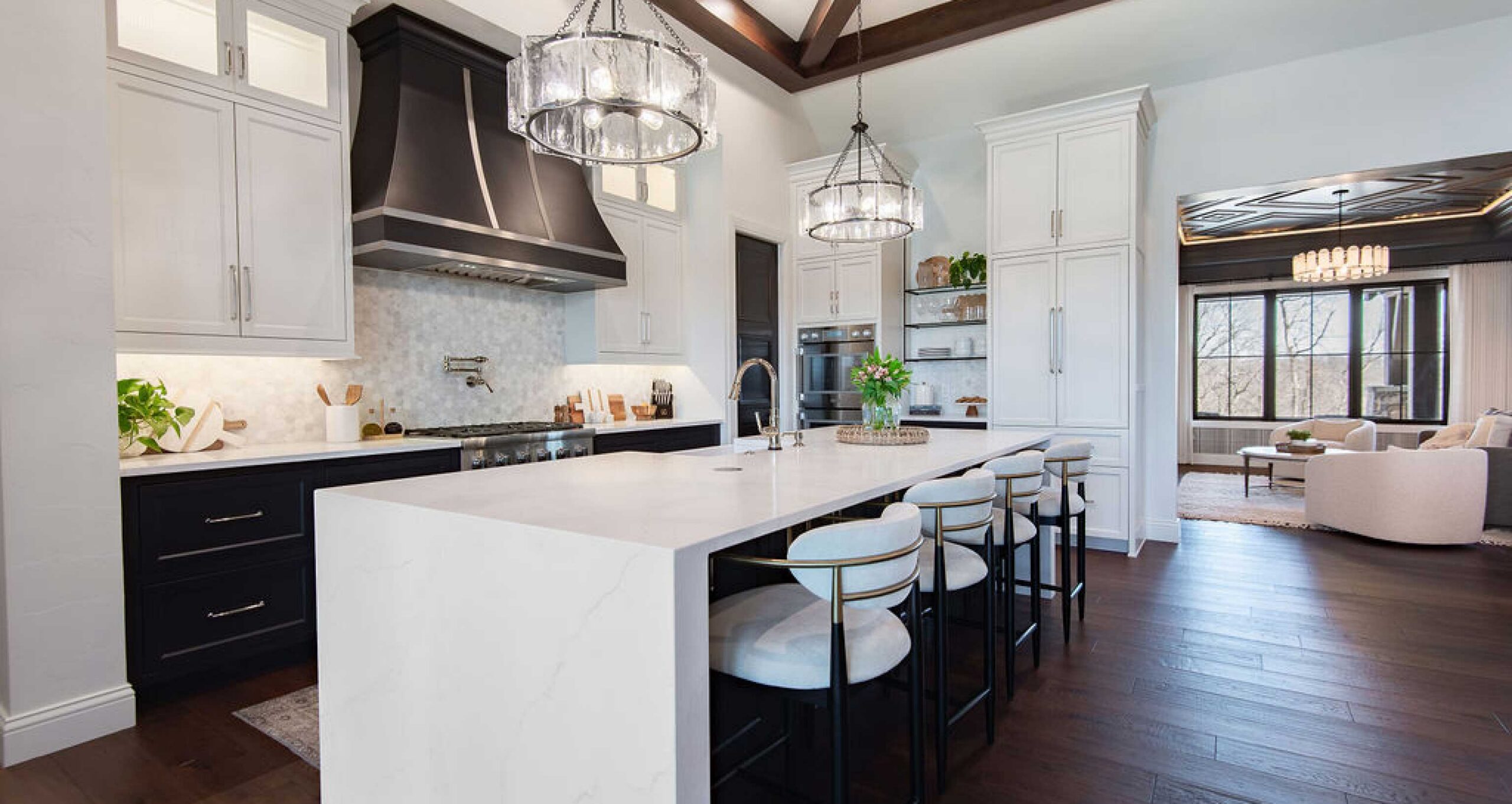 Elegant and open kitchen with bar and modern stove vent