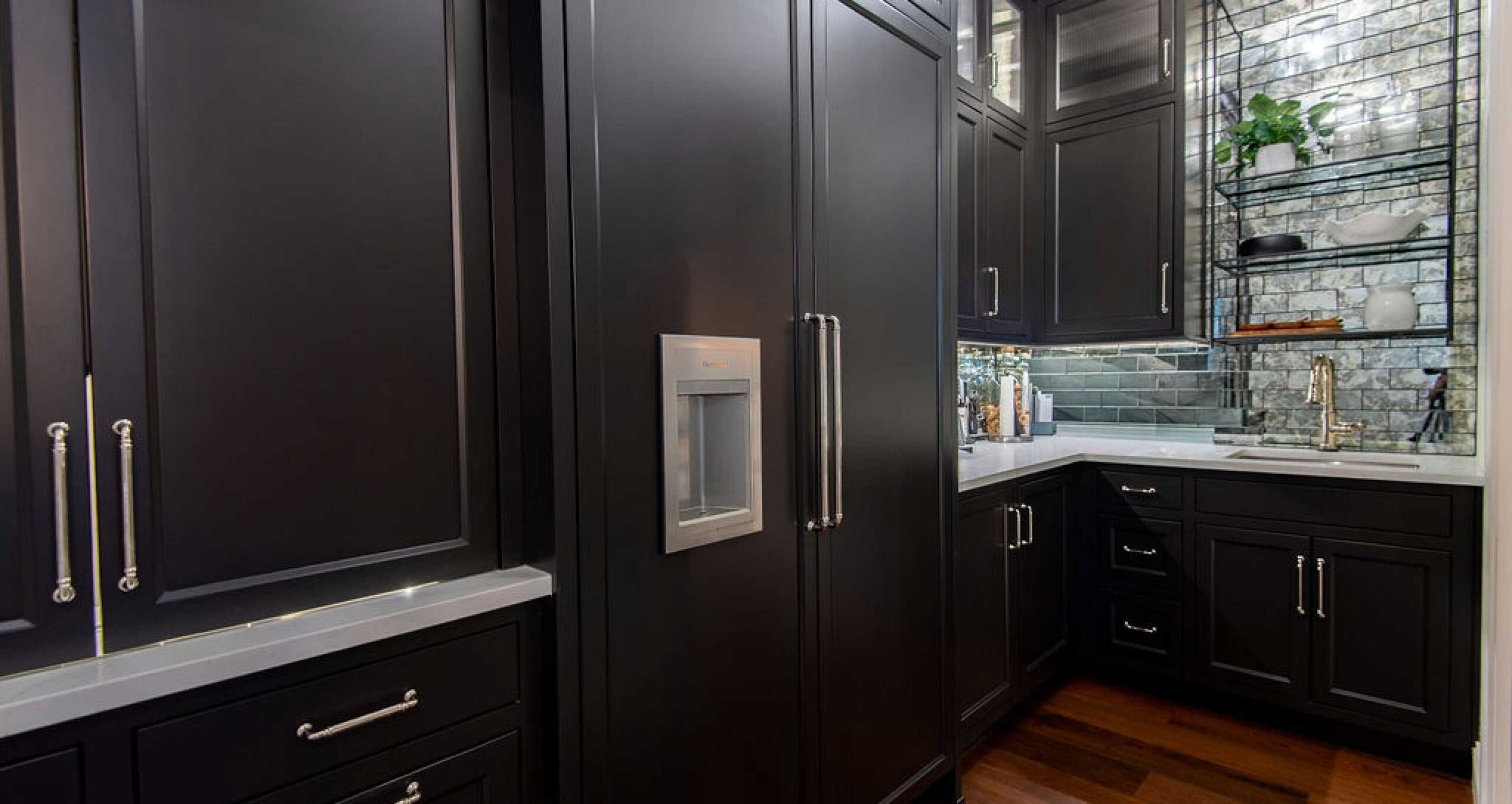 Elegant and open kitchen featuring appliance cabinetry