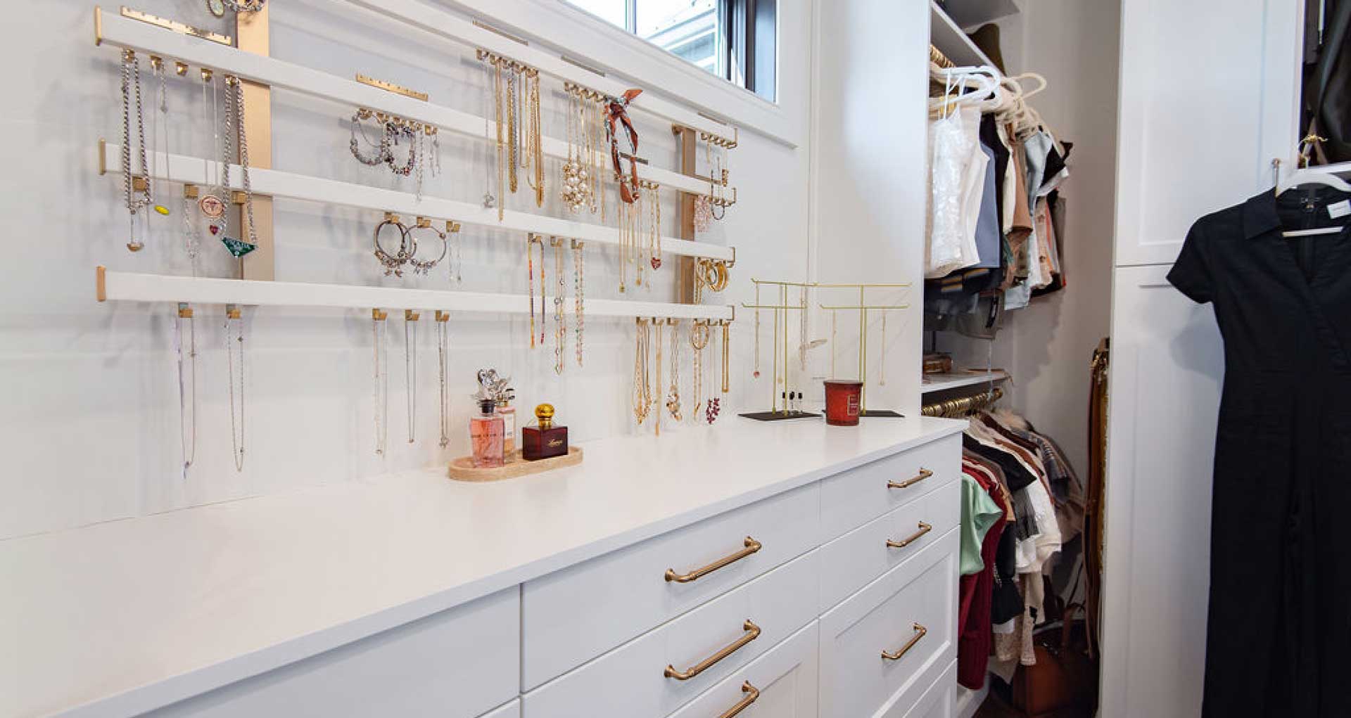 New formal closet featuring large jewelry station close-up