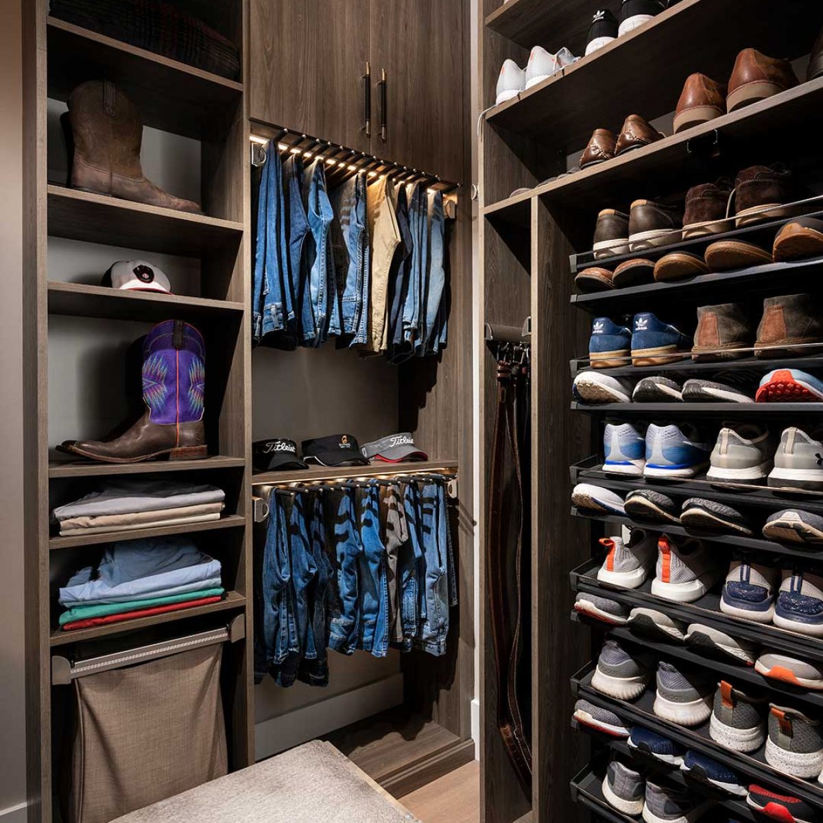 custom closet built in showing shoe racks, shelving and cabinets